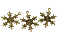 verzierte Schneeflocken als Anhänger in antik...
