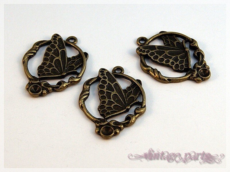 2 Schmetterlinge Ornamente in Bronze