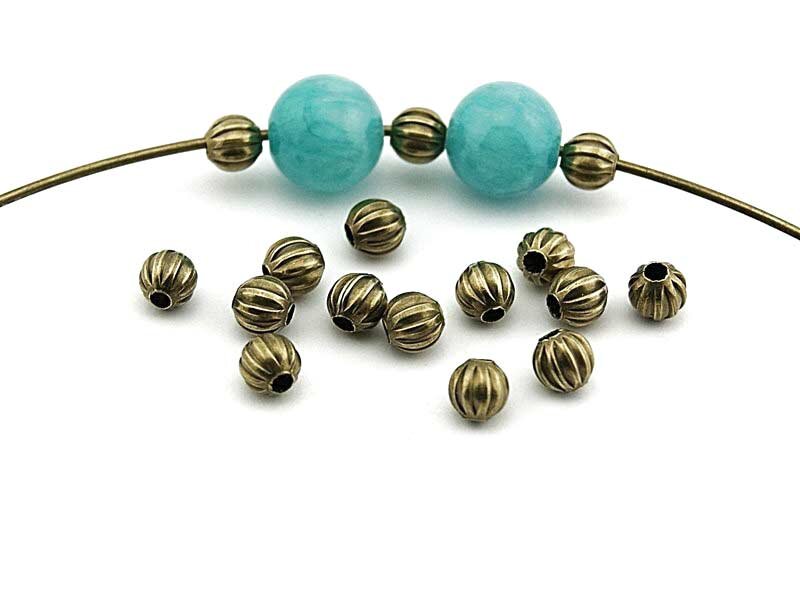 50 Zwischenperlen in antik Bronze, 5 mm