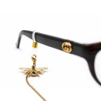 transparente Brillenbandhalter mit Feder in goldfarben...