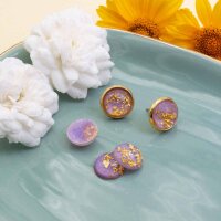 Resincabochons in fliederfarben mit goldfarbenen Glitter...