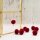Pompoms in dunkelrot aus Polyester 14 mm 30 Stück