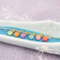 bunte Perlen aus Acryl mit goldfarbener Prägung 7 mm...