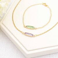 längliche Verbinder in goldfarben mit...