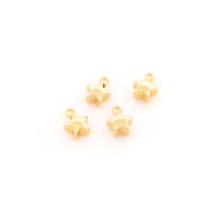 Anhänger als Stern aus Messing mit 18K...