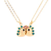 Partnerkette mit Dinosaurier und Zirkonia in Goldfarben