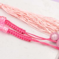 Geknüpftes Armband aus pinker Nylonkordel mit rosa...