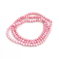 Ein Strang rosa Glasschliffperlen in Bicone-Form, in...