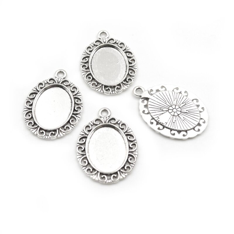 4 filigrane, ovale Fassungen in antik silberfarben, für 18 x 13 mm Cabochons