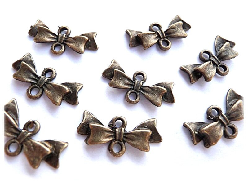 10 Verbinder als Schleifchen in antik Bronze