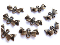 10 Verbinder als Schleifchen in antik Bronze