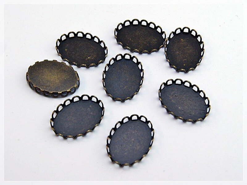 10 Fassungen in antik Bronze für 18 x 13 mm Klebeperlen